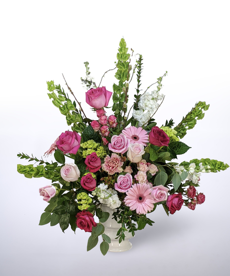 pink, green, and white funeral urn